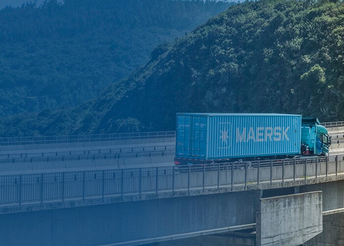 Maersk truck with blue container on bridge