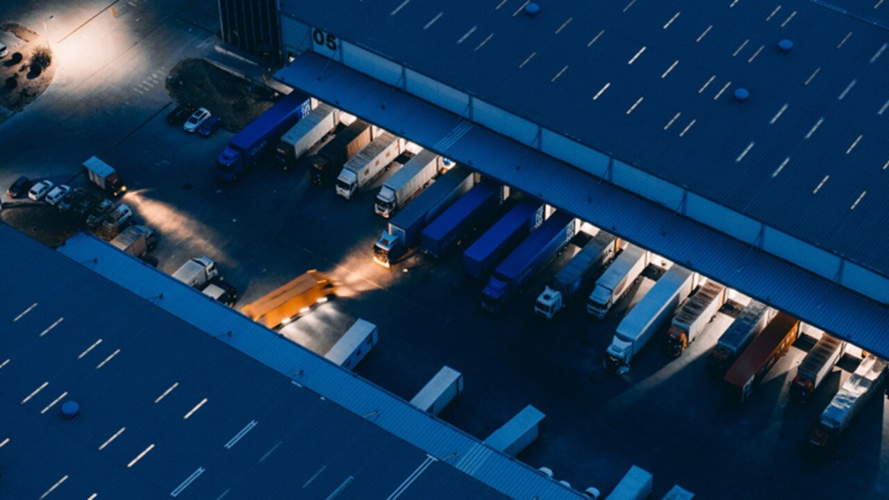Aerial view of trucks outside a warehouse
