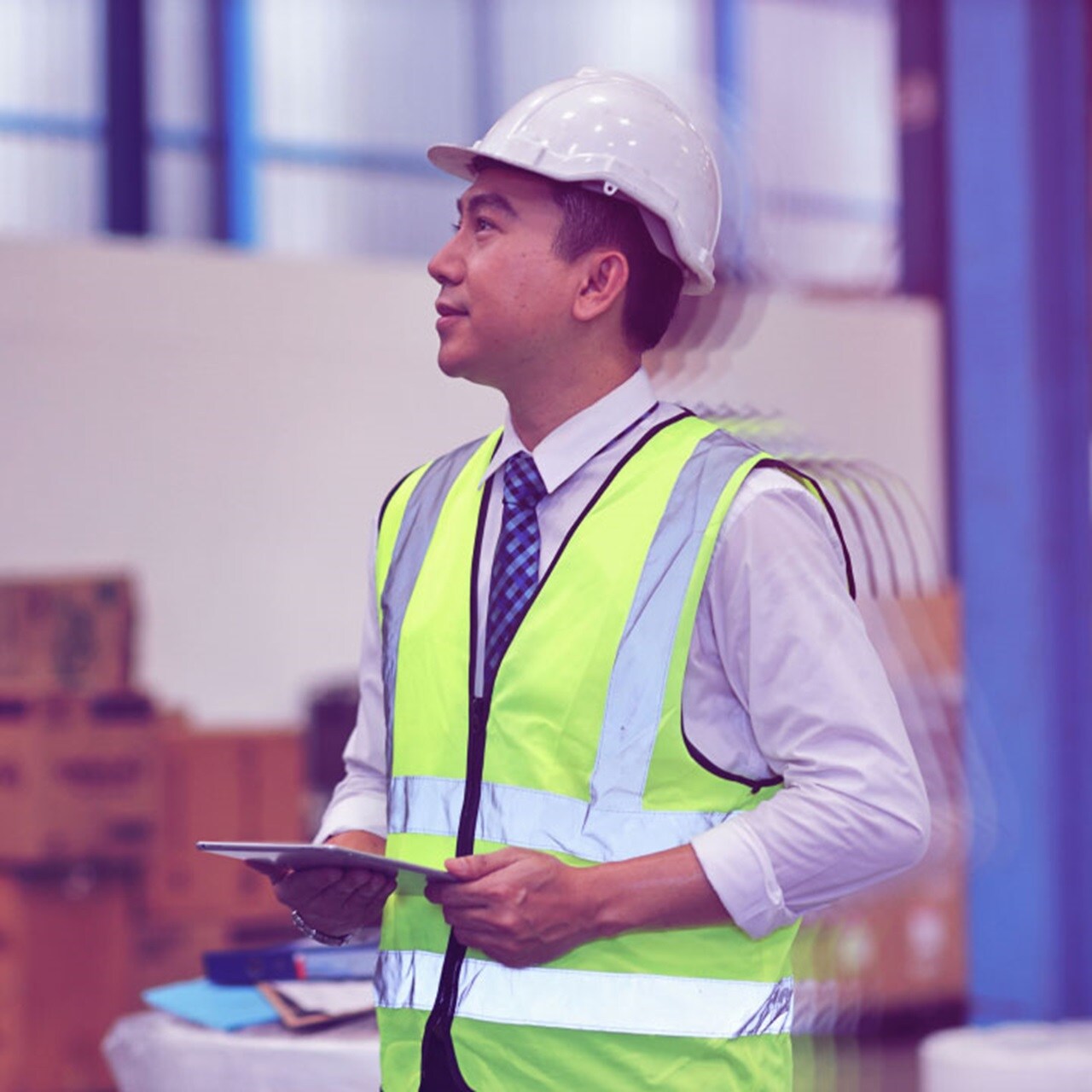 Side look of Asia man holding tab