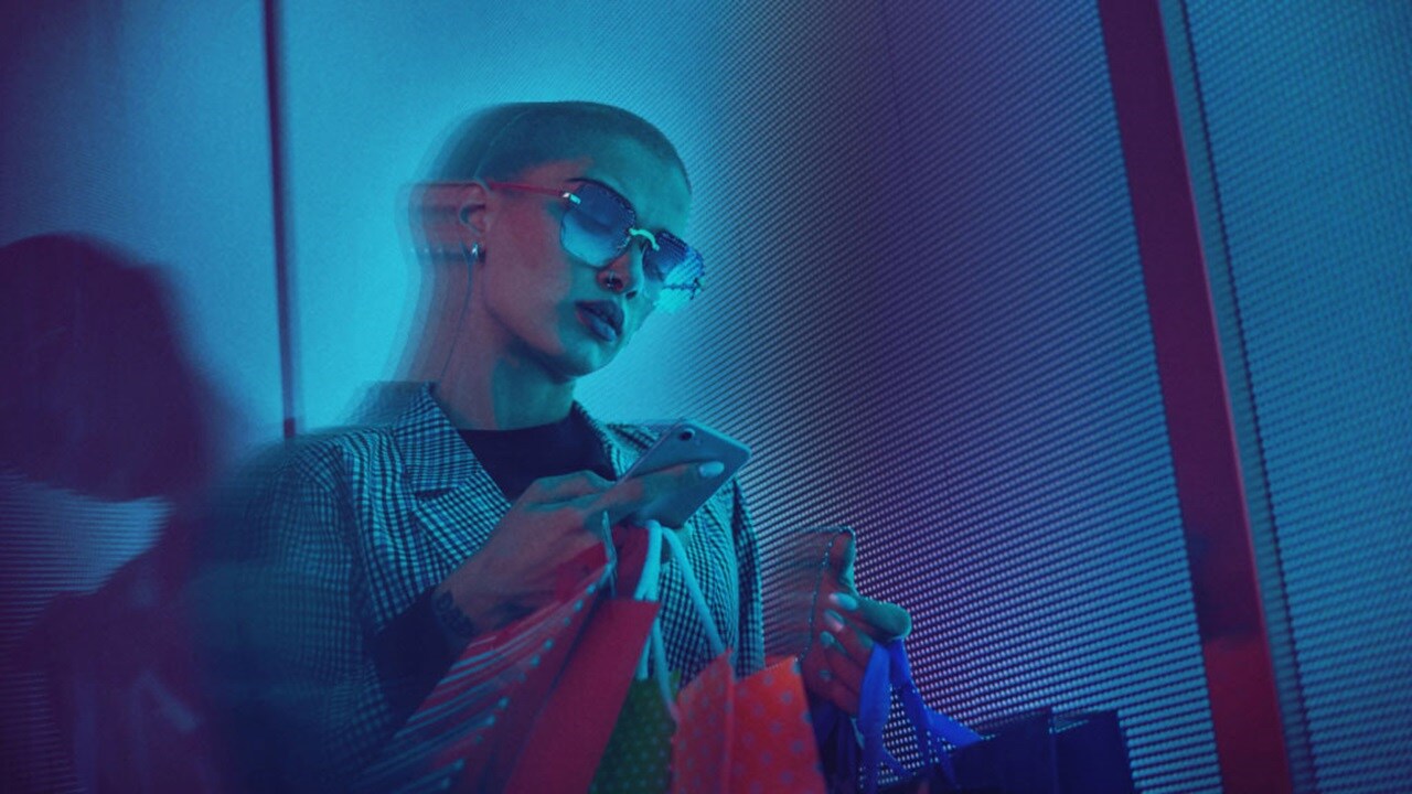 North American woman holding mobile