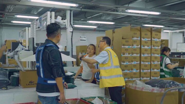 Three employees packing products