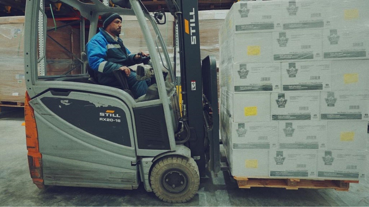 person in moving cargo car 
