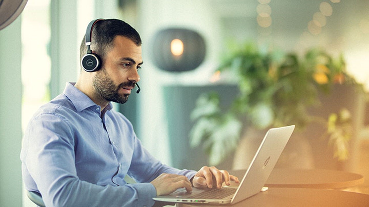The employee is using a laptop for work.