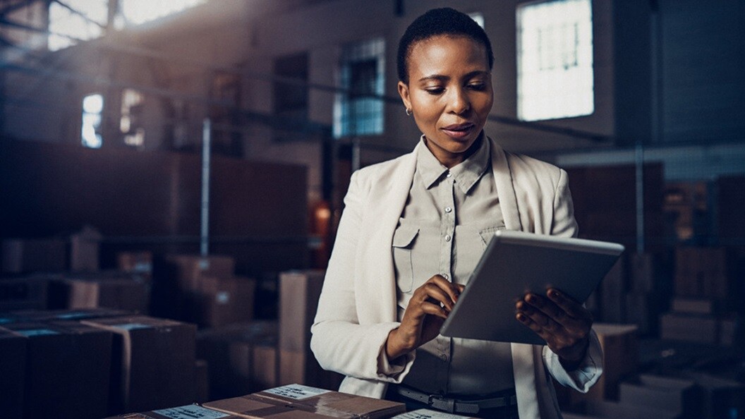 Women with tab in warehouse