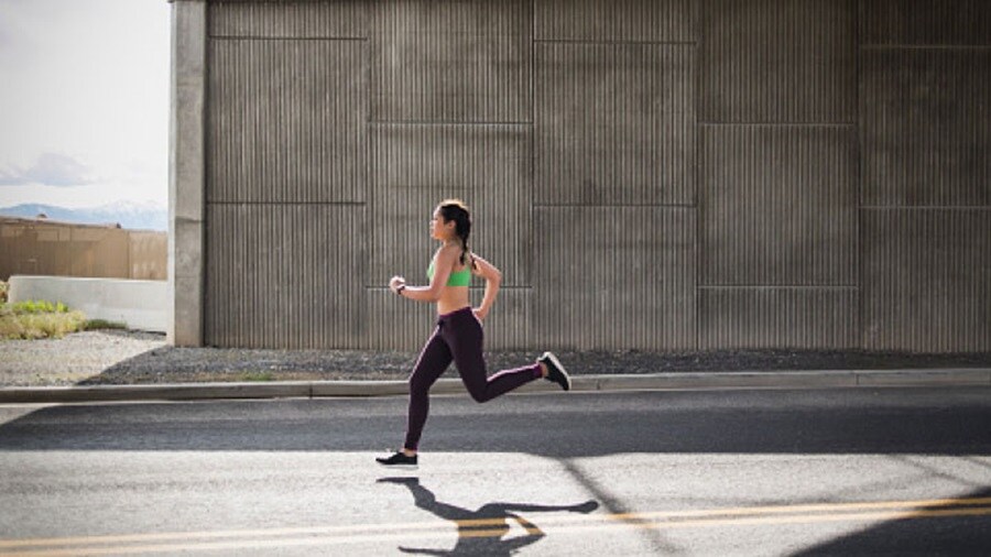 Woman running with black leggings