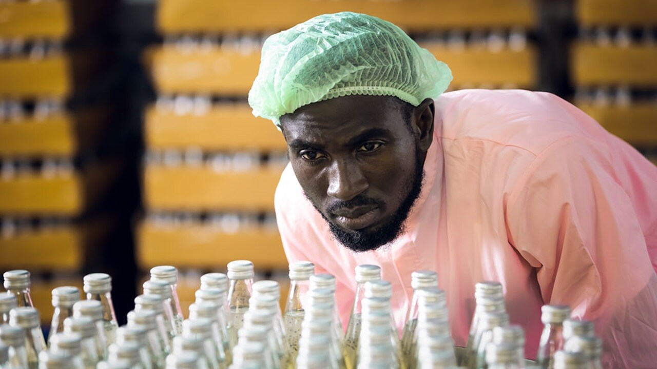 Man examining a bottled product