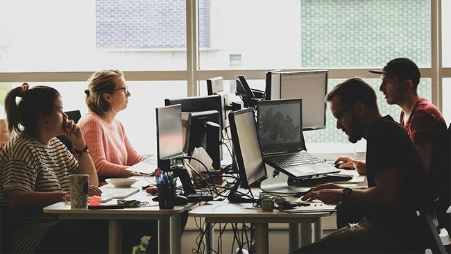 A group of people working in logistics tech startups.