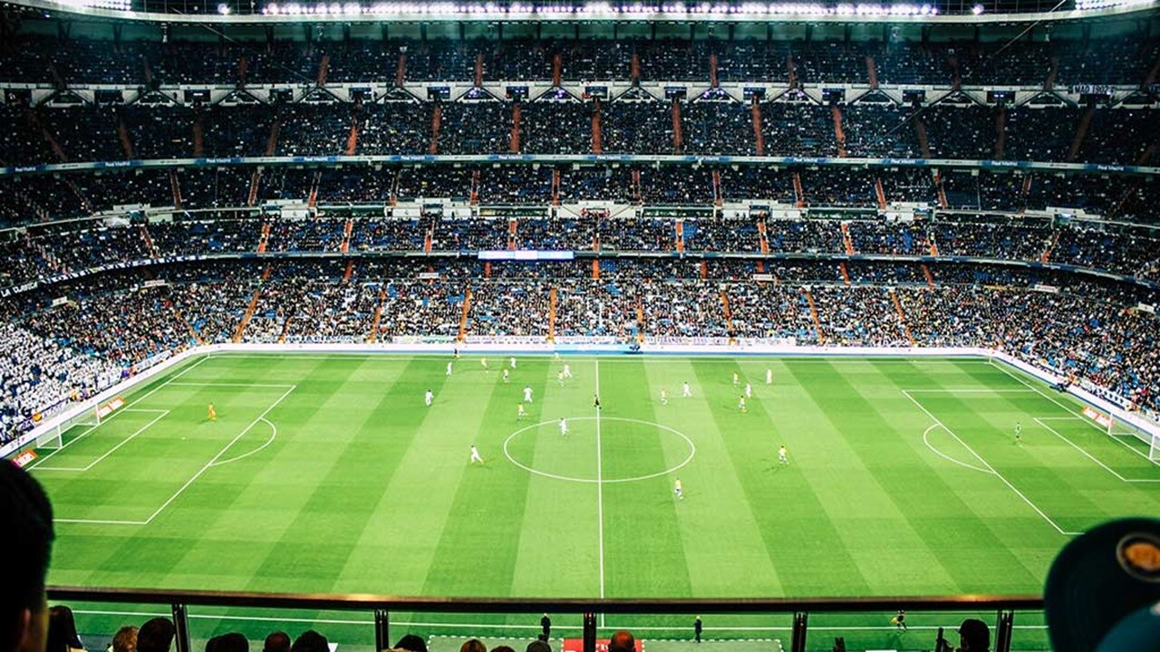 Wide view of a packed football stadium