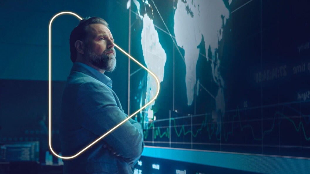 Men watching world map