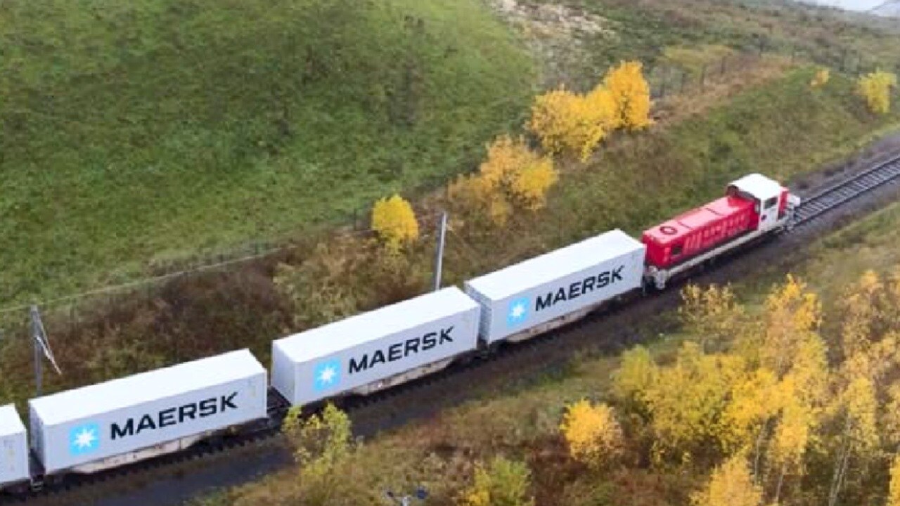 Birds eye shot of inland rail running through fields