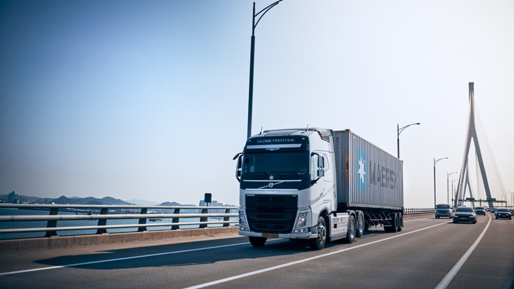 A truck with a Maersk container carrying road cargo.