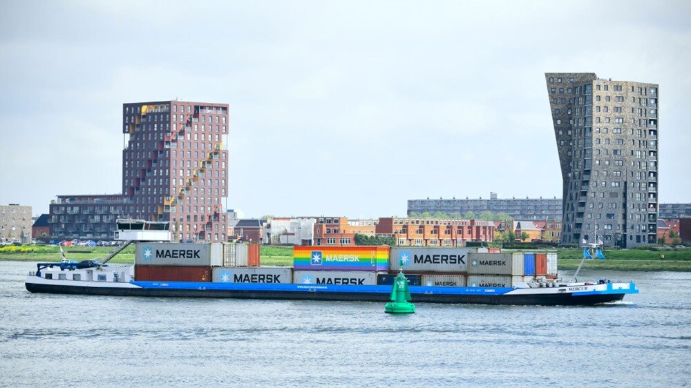 An aerial view of a Maersk ship carrying inland cargo containers.
