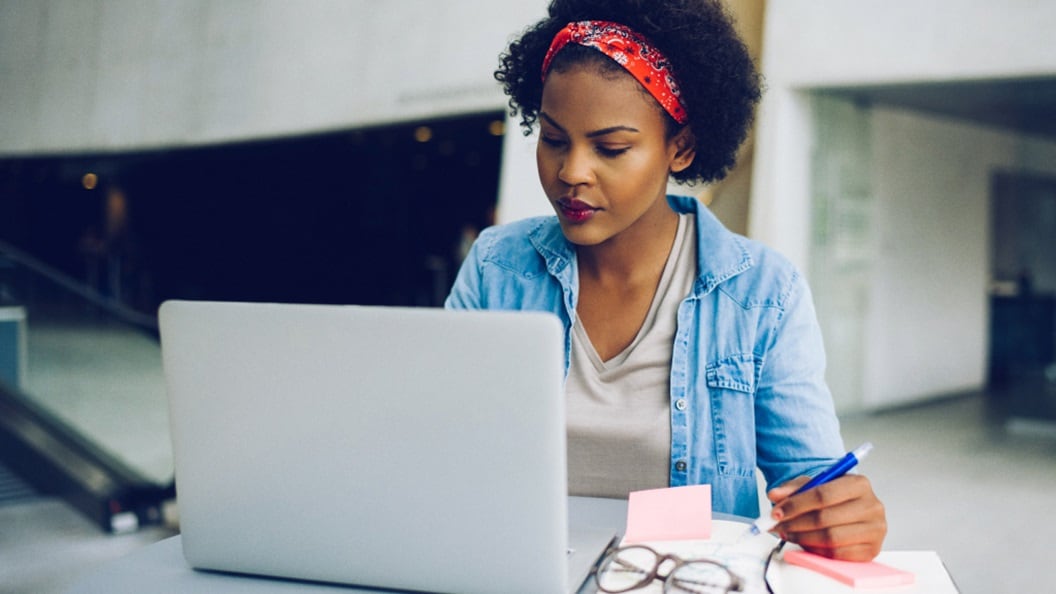 A woman working on a laptop