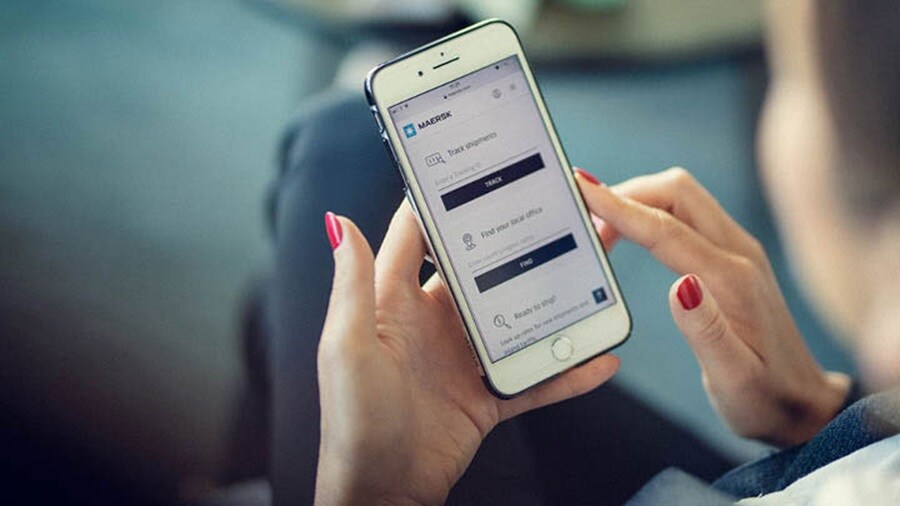 Lady checking the Maersk App