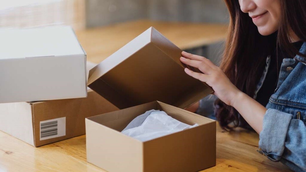 Lady opening her parcel