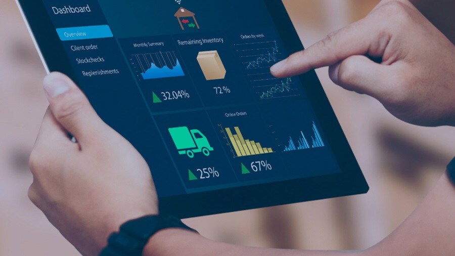 Close up of hands working on a tablet