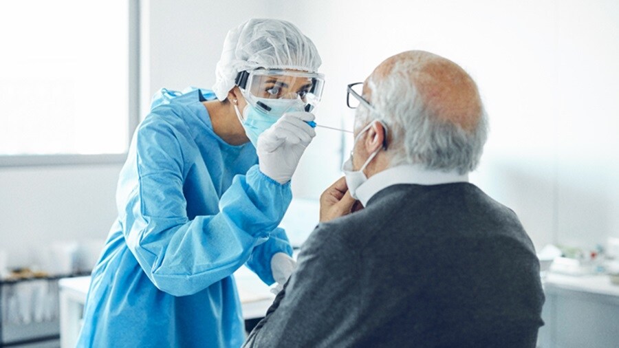 Swab collection for covid-19 test from an old man