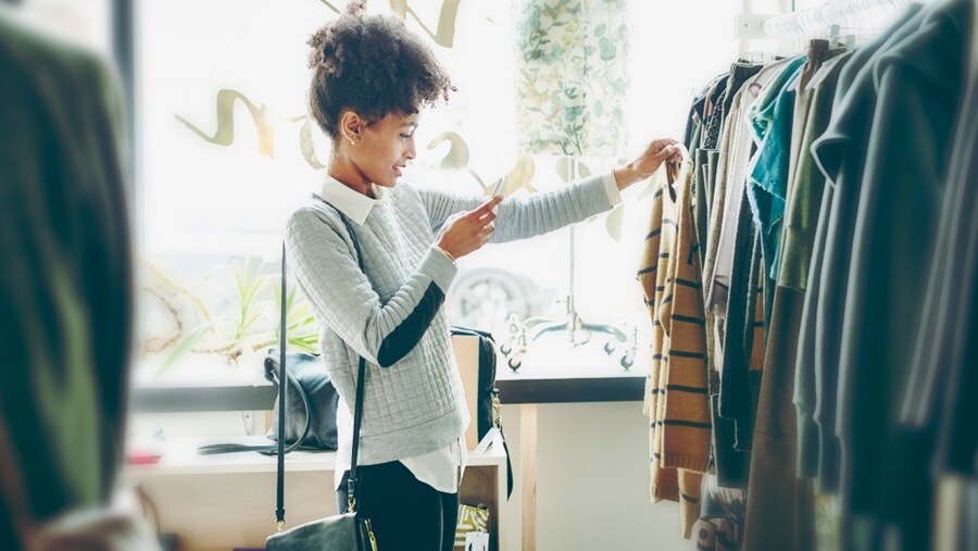 Woman checking out clothes at a store