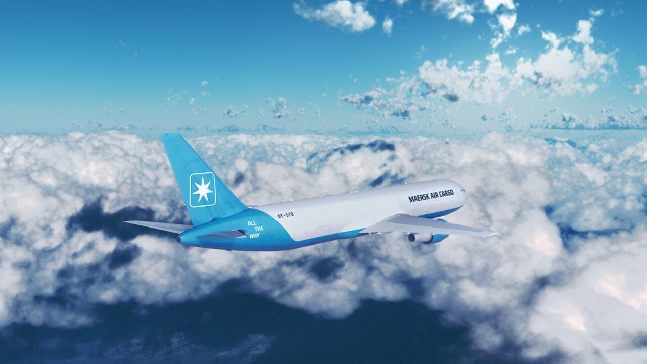 Maersk air cargo plane flying amongst the clouds