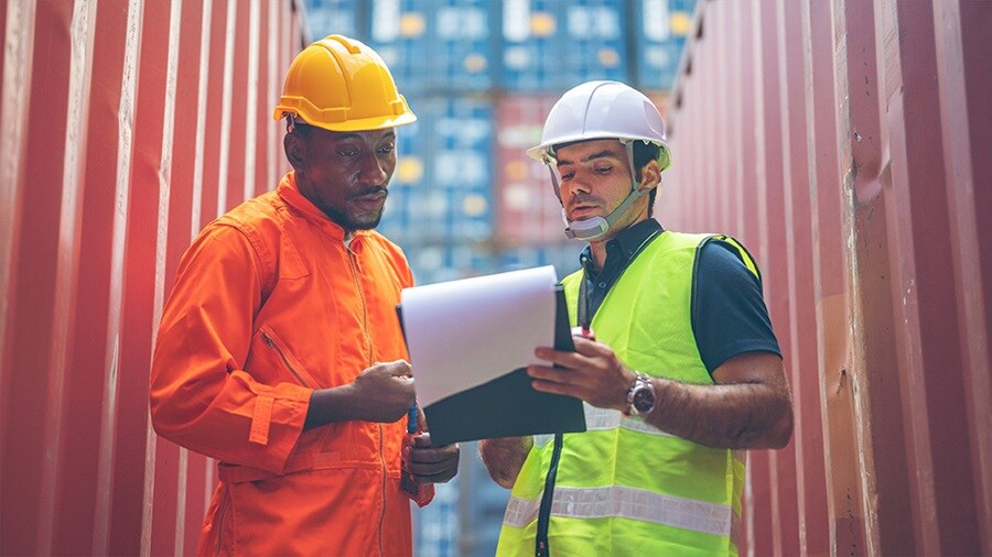 Two men at container yard