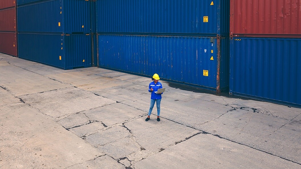 Woman at container dock