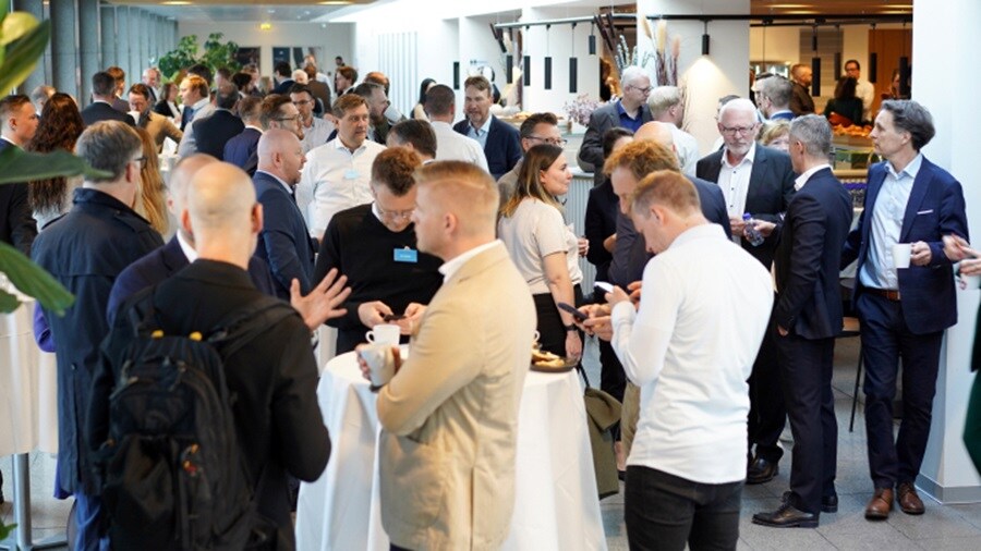 Group of people conversing at an event