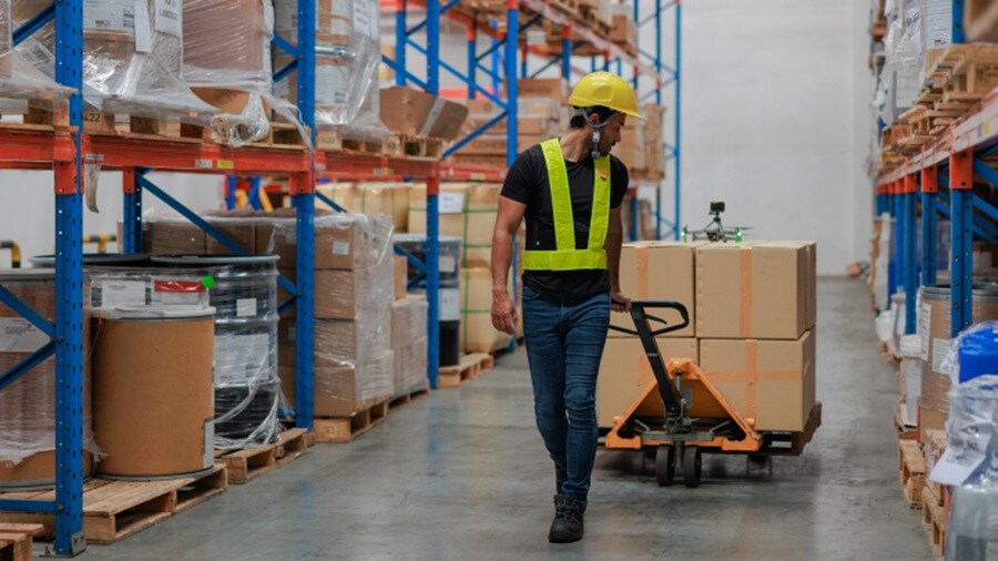 Man taking out shipments from warehouse