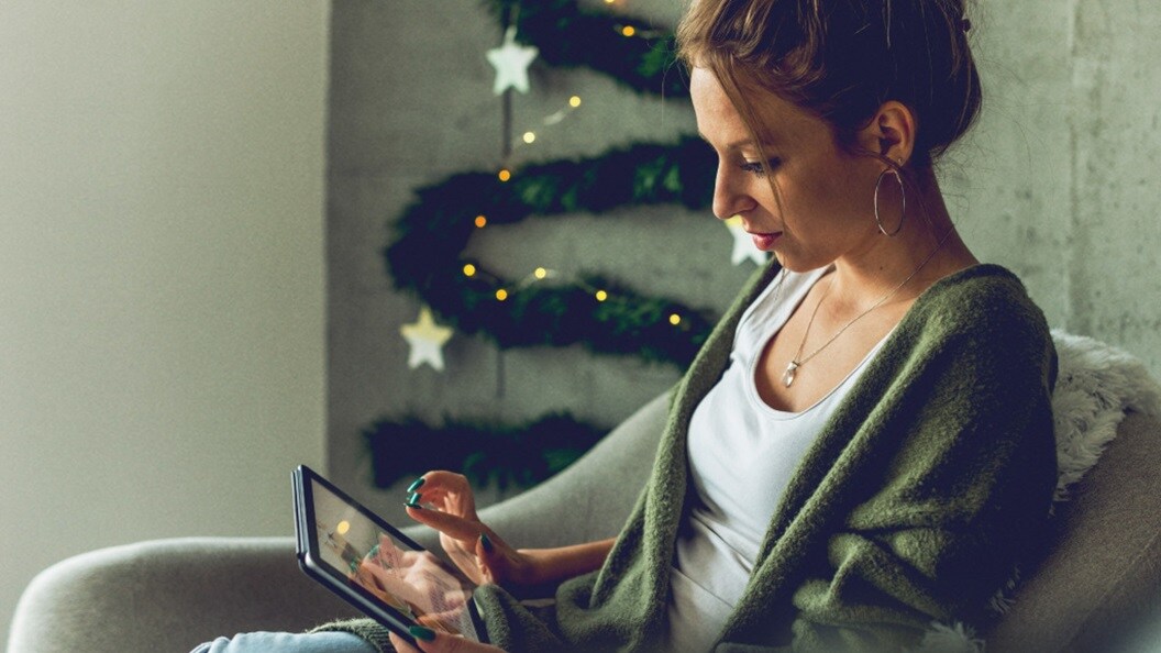 Two male and two female conversing in a conference room 