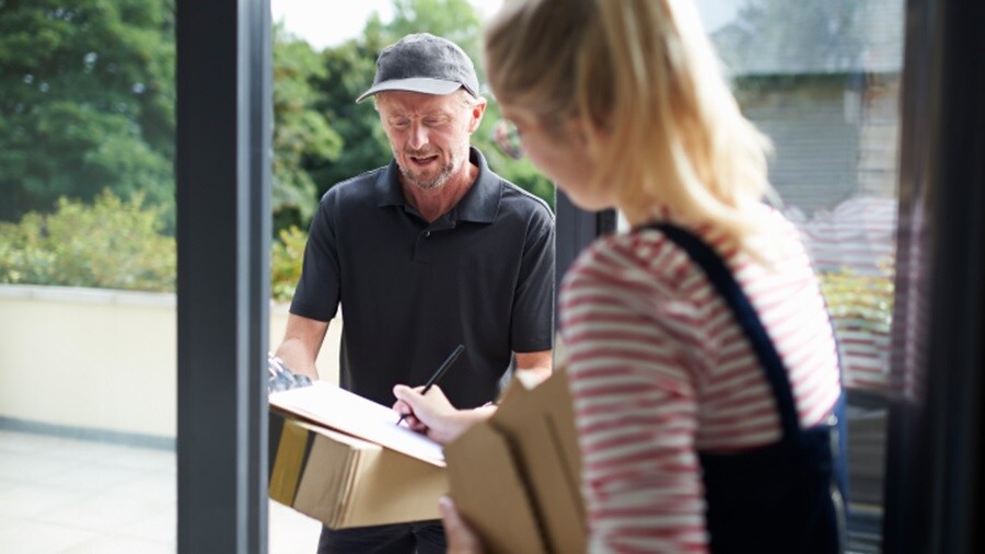 Male delivering a shipment to a female