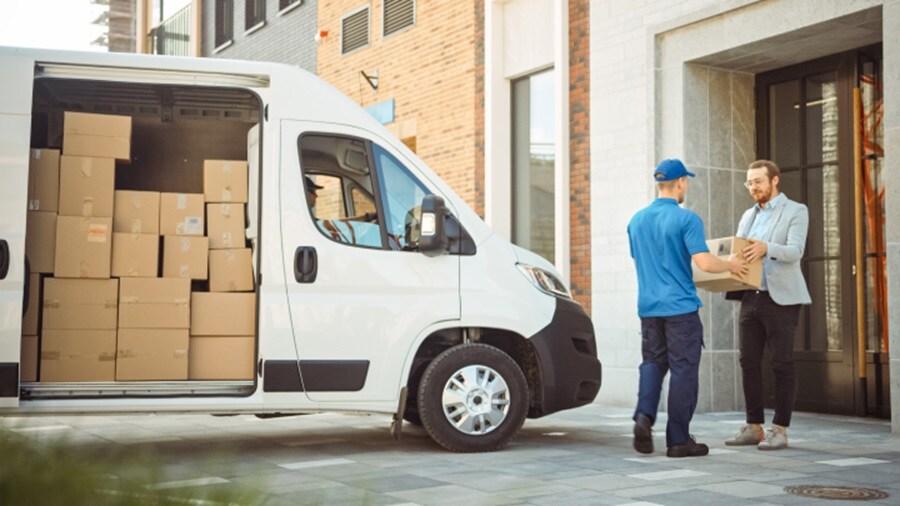 Male delivering a shipment to another male