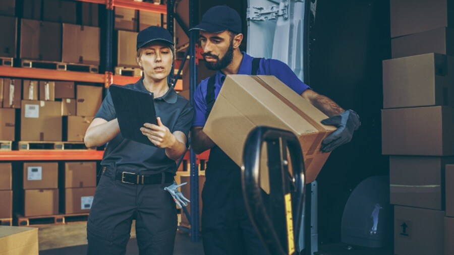 A male and a female working in a warehouse