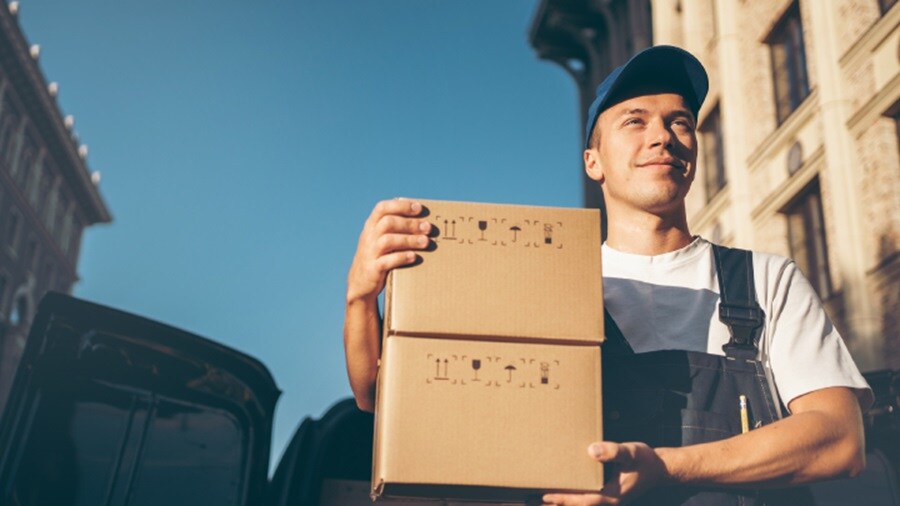 Male holding two packages