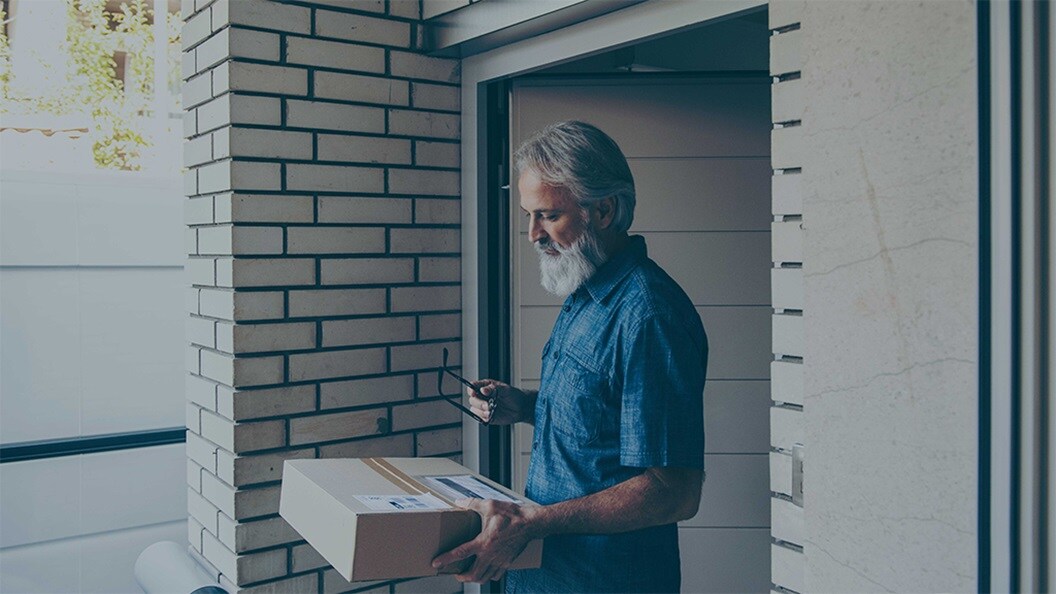 A male looking at the parcel