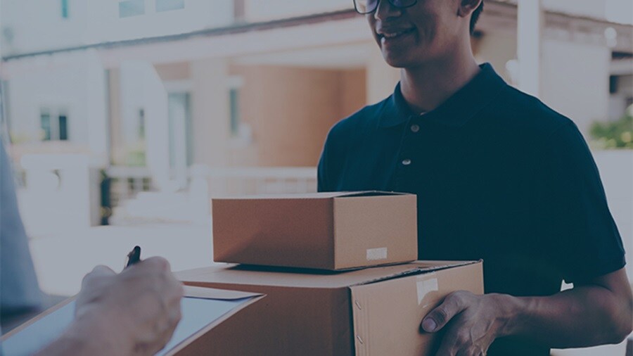 Male delivering parcel to another male