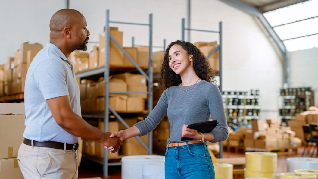 A male and a female shaking hands