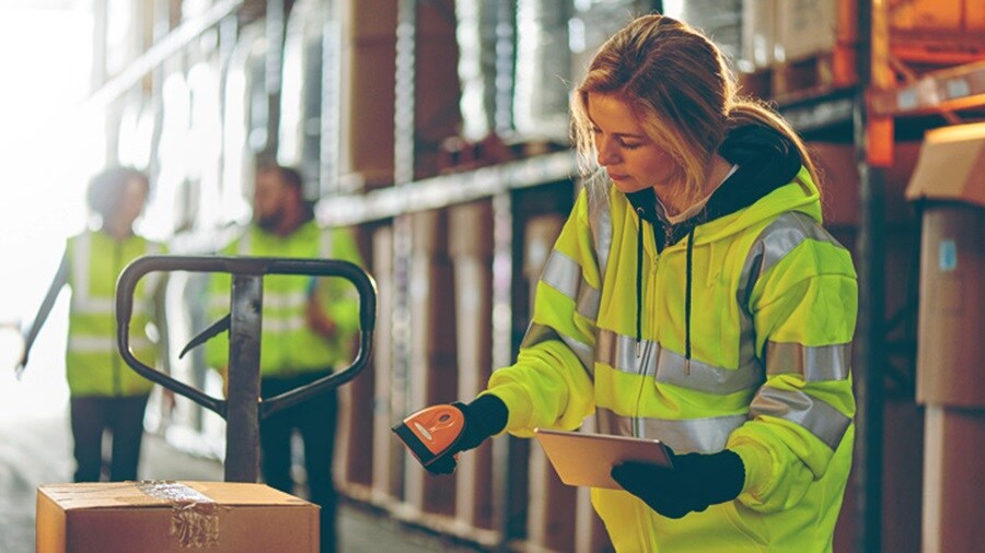 Female scanning a shipment in a warehouse