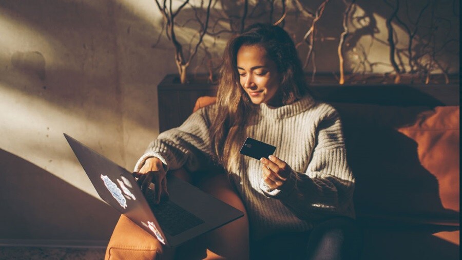 Female smiling looking at her laptop