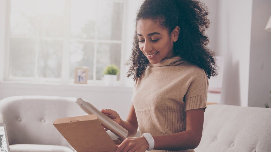 Female opening a box of shipment