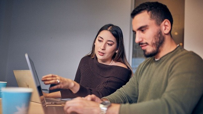 Woman and man at laptop