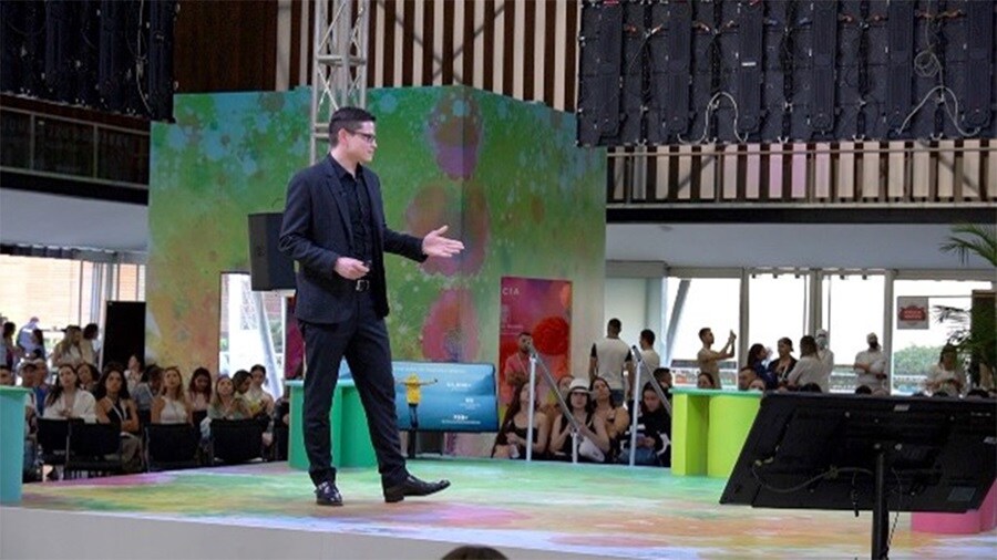 A man presenting at colombia tex event