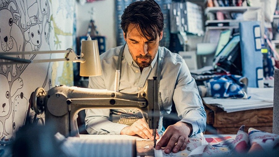 Man sewing clothes