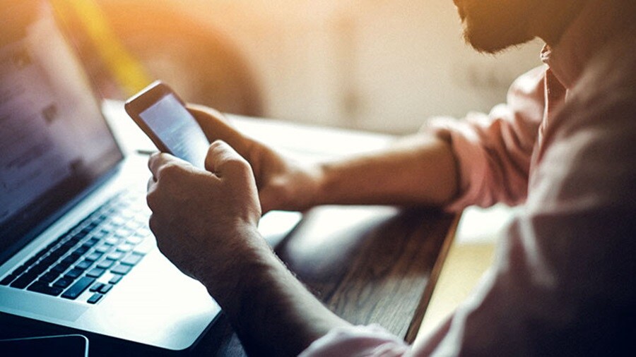 Man with mobile phone in hands
