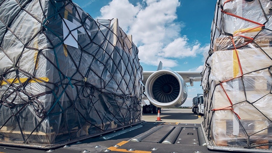 Plane engine between the cargo on an airstrip