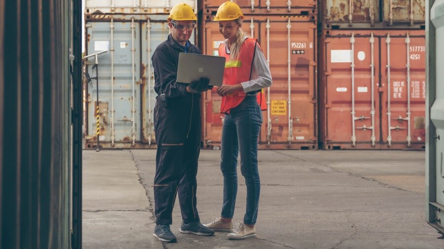 Two people conversing at the container port