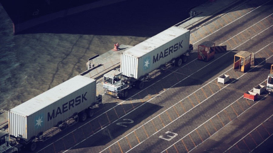 Trucks with Maersk containers, on a highway