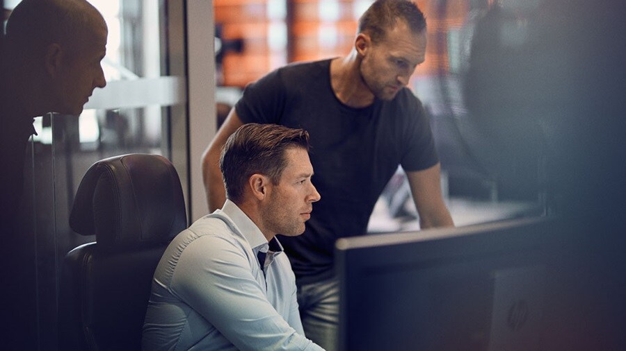 Two logistics professionals analysing blank sailings ahead of the Golden Week.