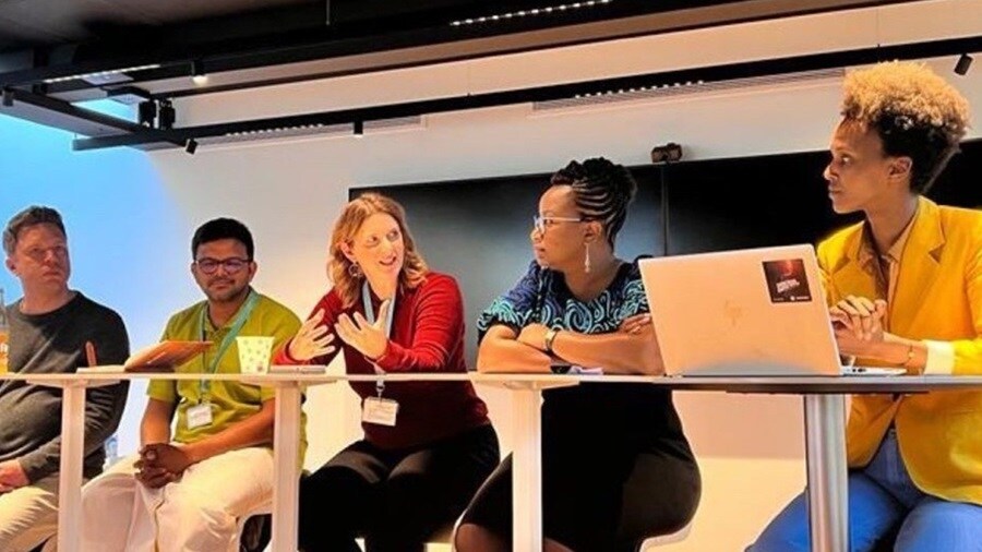 Gillian Howarth making conversation with colleagues