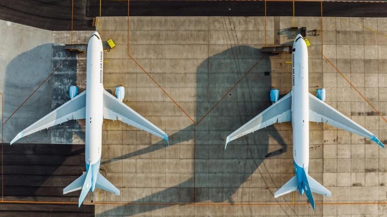 Overview shot of two plane parked on an airstrip