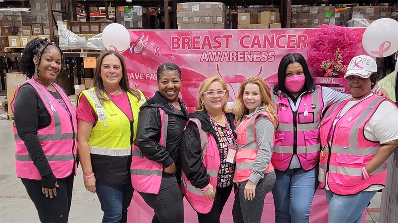 A group of women in pink vests
