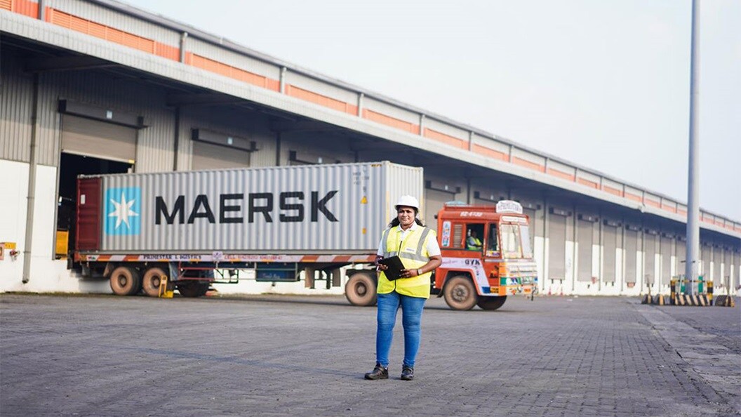 Women in front of warehouse